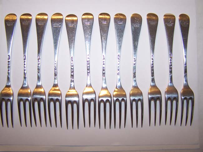 A Fine and Rare Set of 12 English Silver Three-Prong Dessert Forks by Ebenezer Coker, London 1748, each with a 'Coronet' crest. — image 2